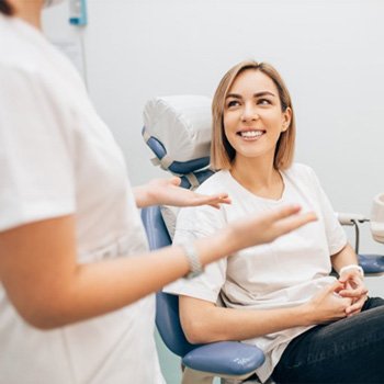 patient talking to her dentist  