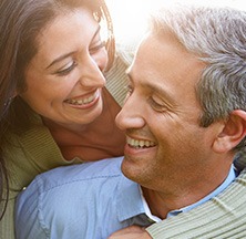 Smiling older man and woman outdoors