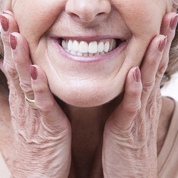 Woman smiling with dentures in Wylie