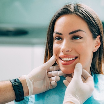 Wylie dentist examining patient's smile