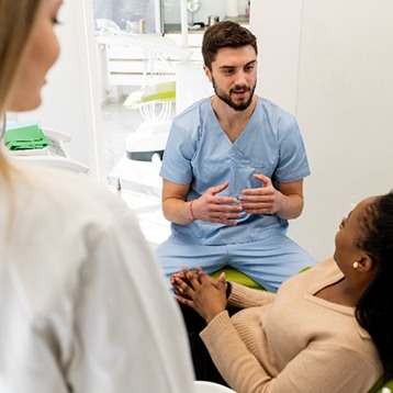 Wylie dentist explaining risk factors of oral cancer to patient