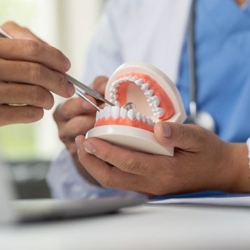 Wylie dentist explaining oral cancer symptoms to patient