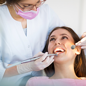 Woman receiving dental exam