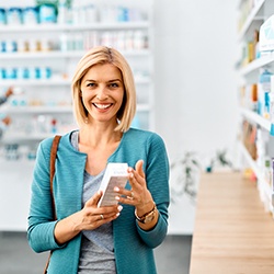 Patient in Wylie at pharmacy looking at teeth whitening options