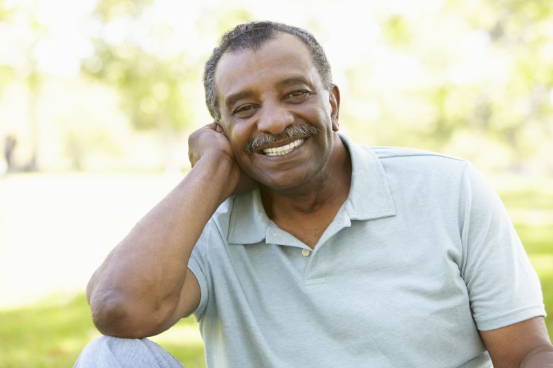 older man smiling grey hair
