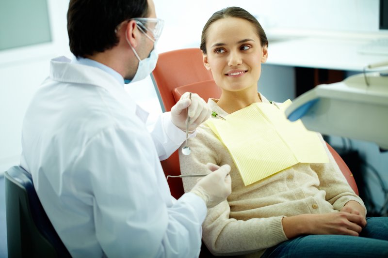 Dentist explaining root canal cost to a patient