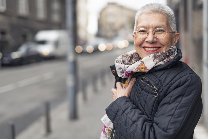 Woman smiling with dentures in Wylie