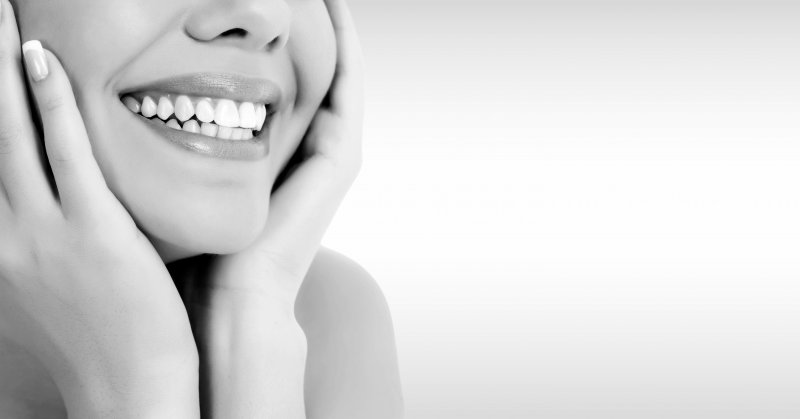 woman smiling in gray background