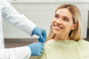 a patient smiling before receiving a dental filling