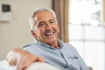 smiling older person wearing dentures