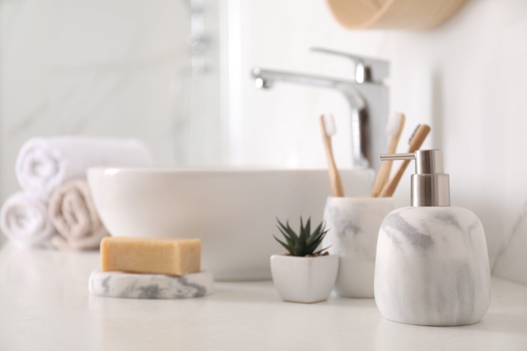 Clean bathroom counter with marble accents