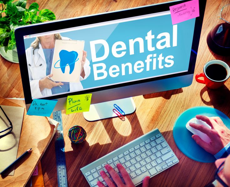 A computer monitor with dental insurance info on it
